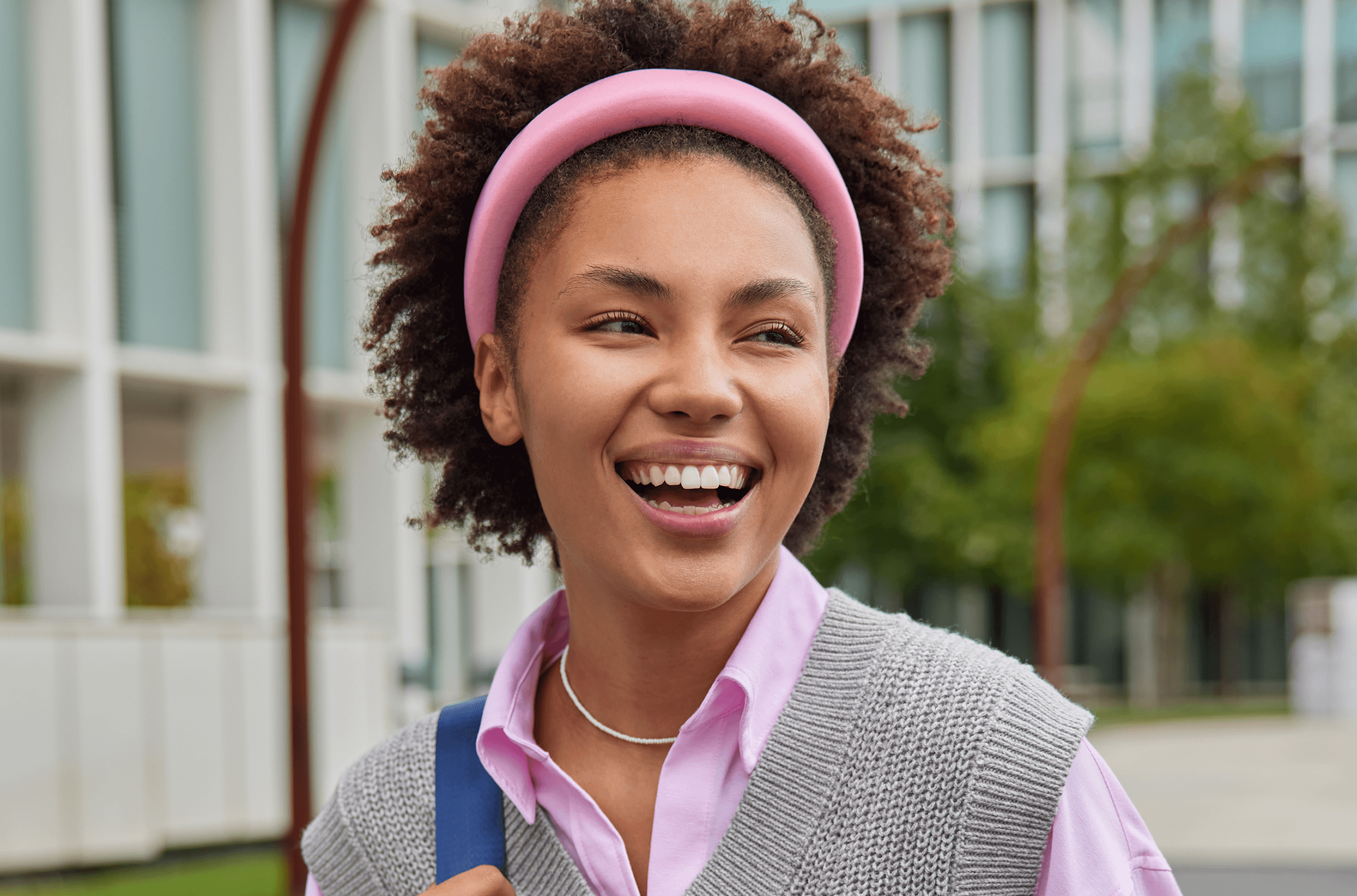 Young African woman smiling, representing Dvoice Academy students