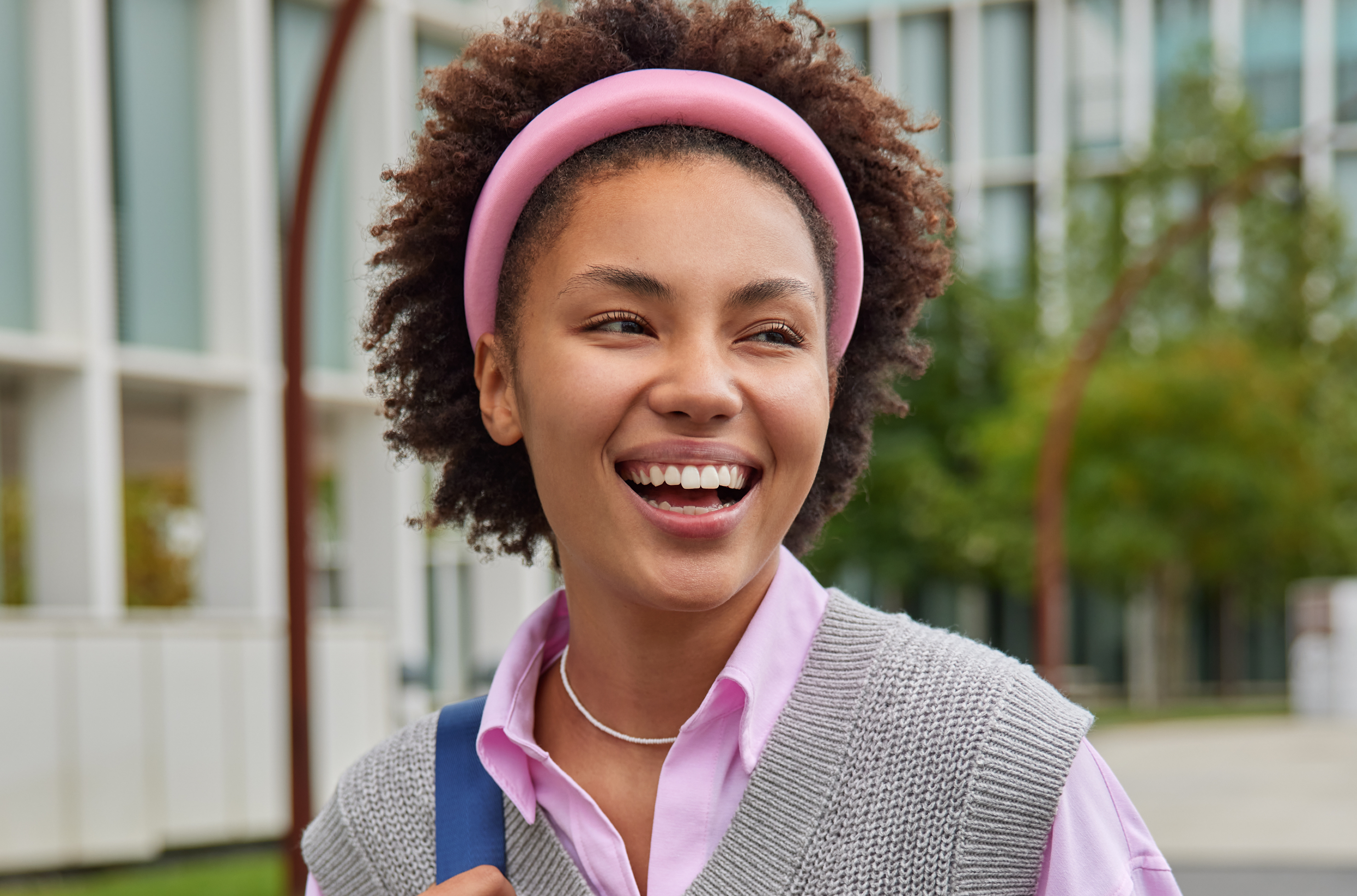 Young African woman smiling, representing Dvoice Academy students